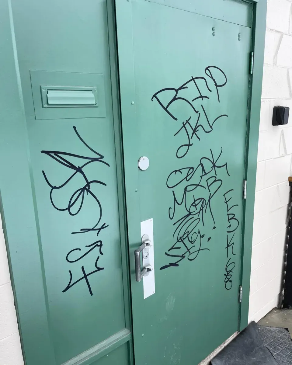 Commercial door before repainting by MV Painting Inc.