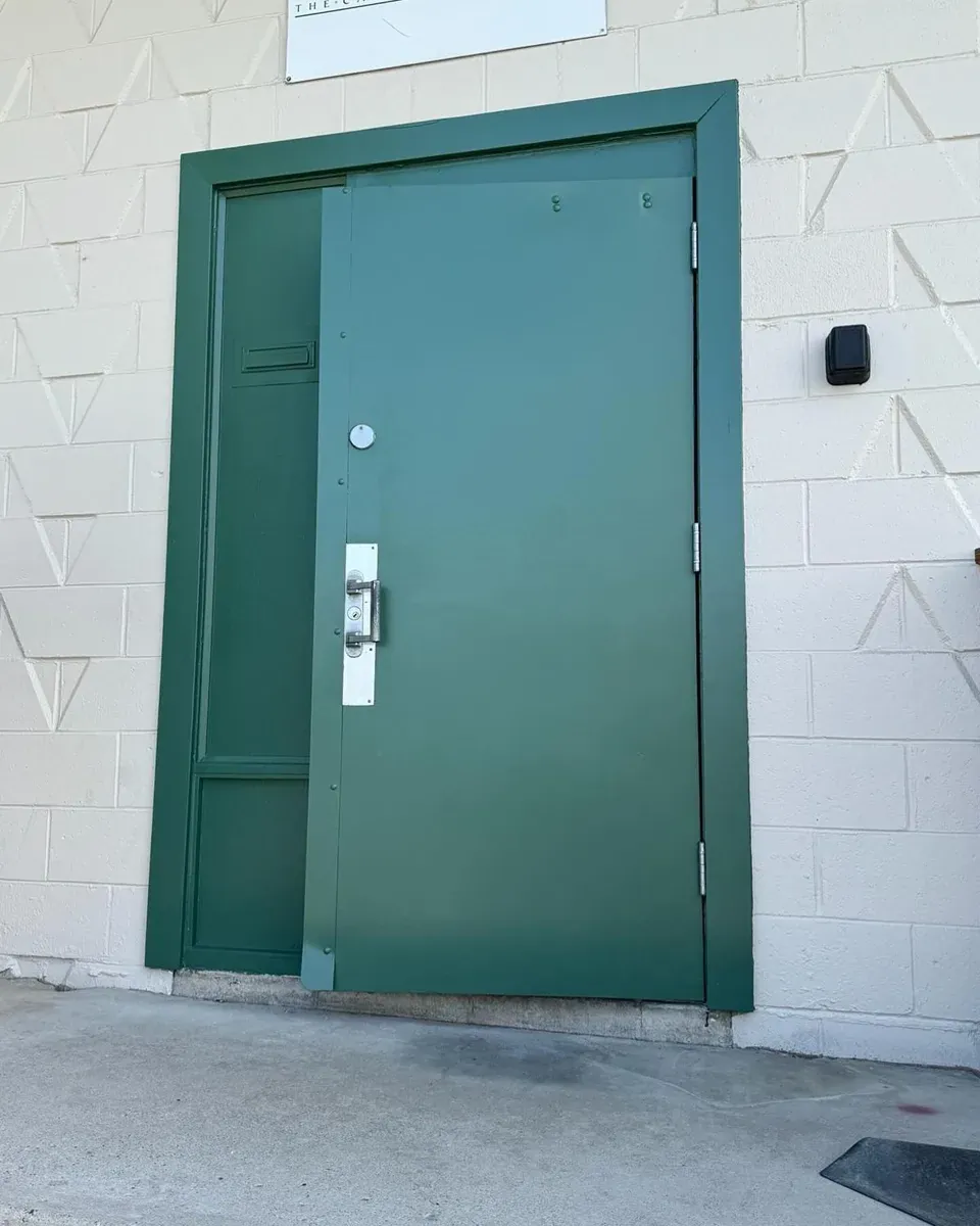 Commercial door after repainting by MV Painting Inc.